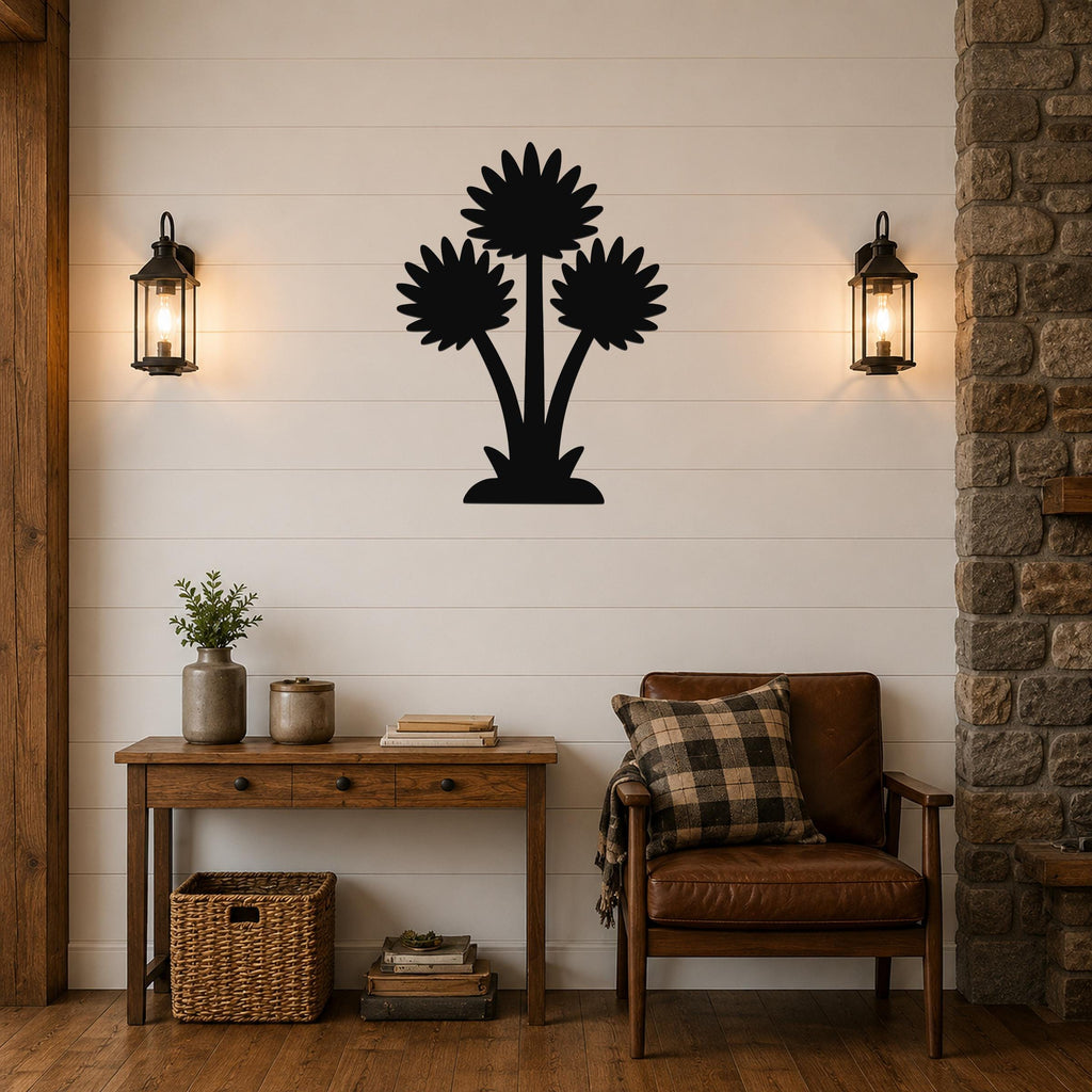 Black metal wall art with a silhouette of three wildflowers, mounted on a shiplap wall above a wooden console table in a living room.