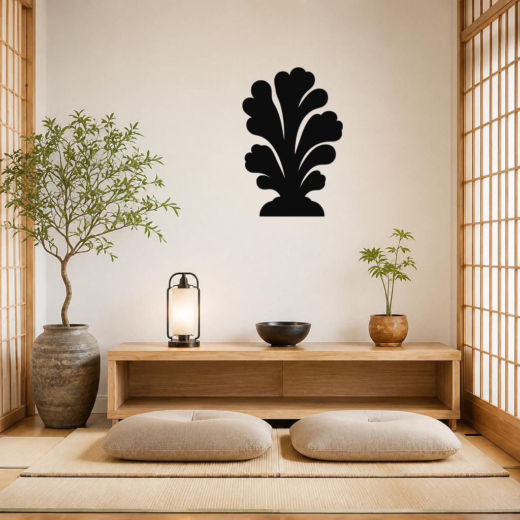 Black metal wall art in a coral silhouette design, mounted on a living room wall above a wooden console table.