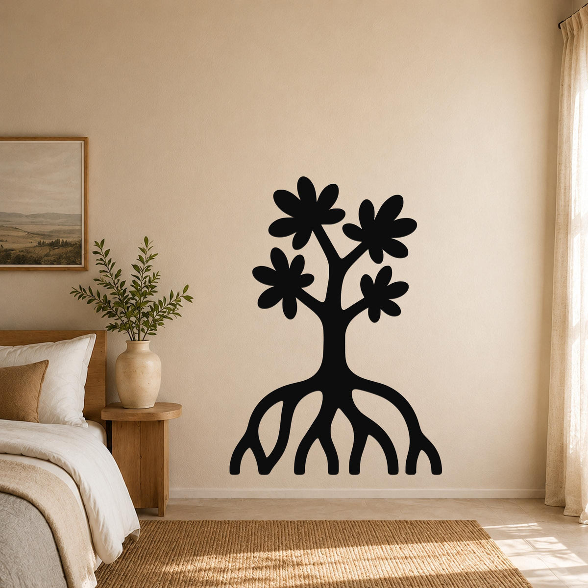 Black metal wall art in a tree silhouette with four flower shapes and exposed roots, mounted on a beige bedroom wall above a woven rug.