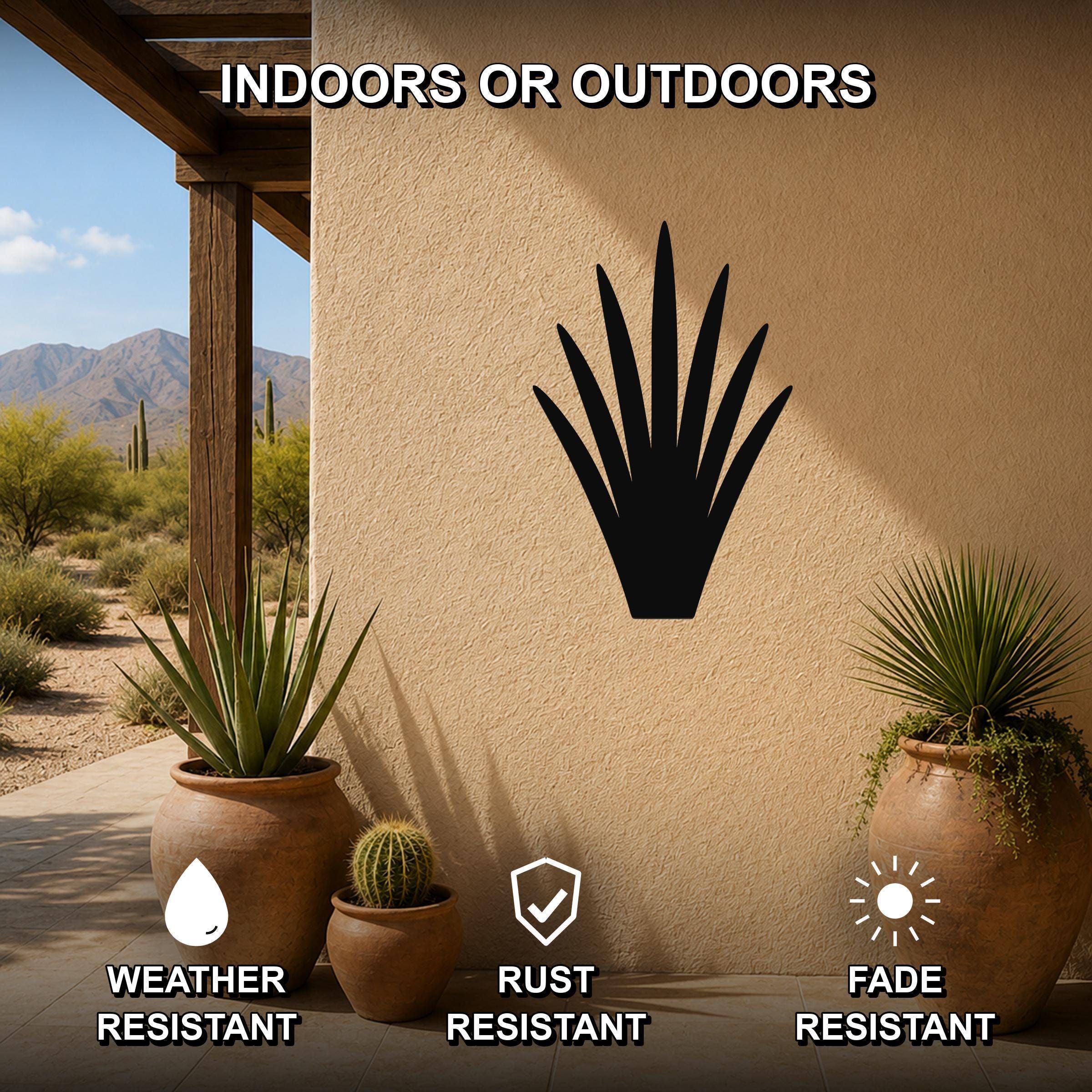 Black metal yucca wall art silhouette mounted on an outdoor patio wall, displayed above potted plants with weather, rust, and fade resistance features.