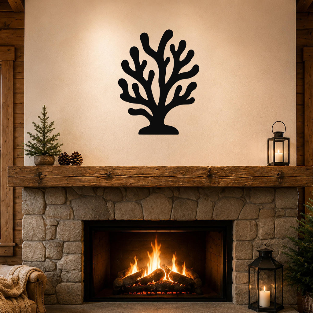 Black metal coral wall art with branching cutouts, mounted above a stone fireplace in a rustic living room.