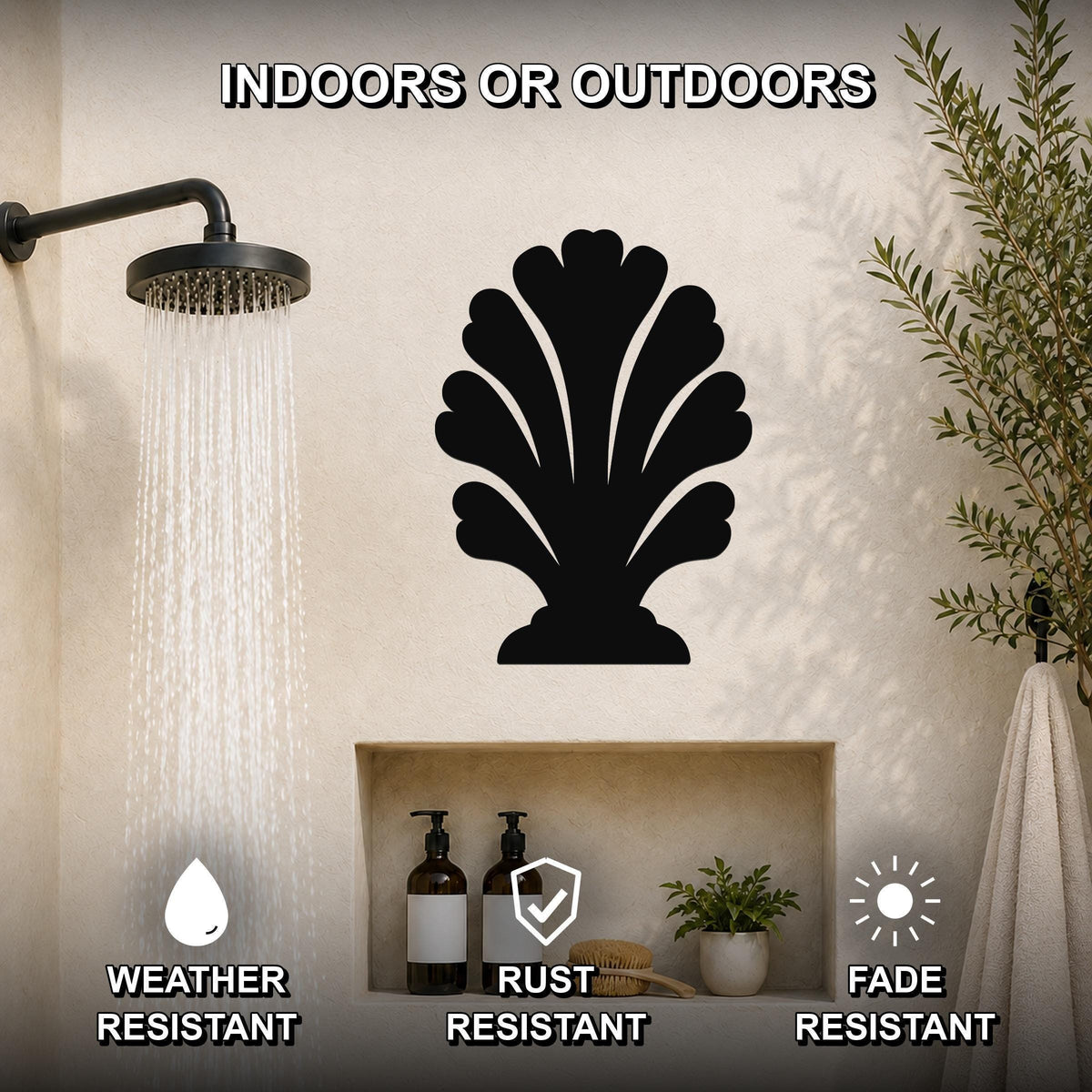 Black metal shell wall art with scalloped cutouts, mounted on a bathroom wall above a built-in shelf, shown under a running shower with text highlighting weather, rust, and fade resistance.