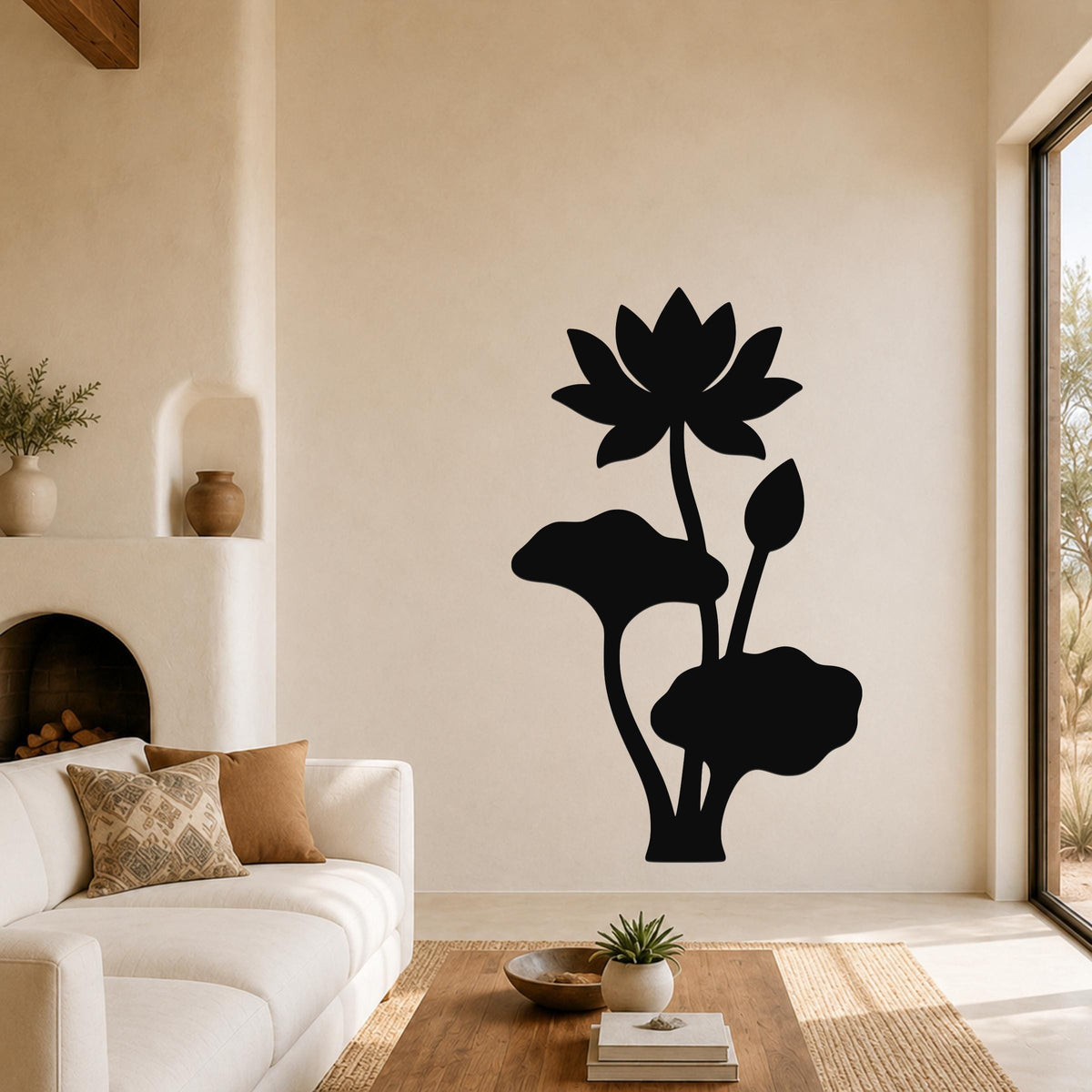 Black metal lotus wall art with flower and leaf cutouts, mounted on a living room wall above a sofa.