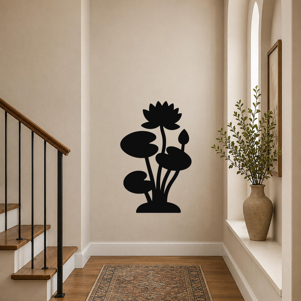 Black metal wall art silhouette of a lotus and water lily, mounted on a hallway wall above a patterned rug near a staircase.