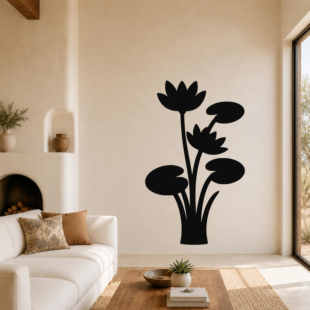 Black metal lotus and water lily wall art silhouette mounted on a living room wall above a sofa.