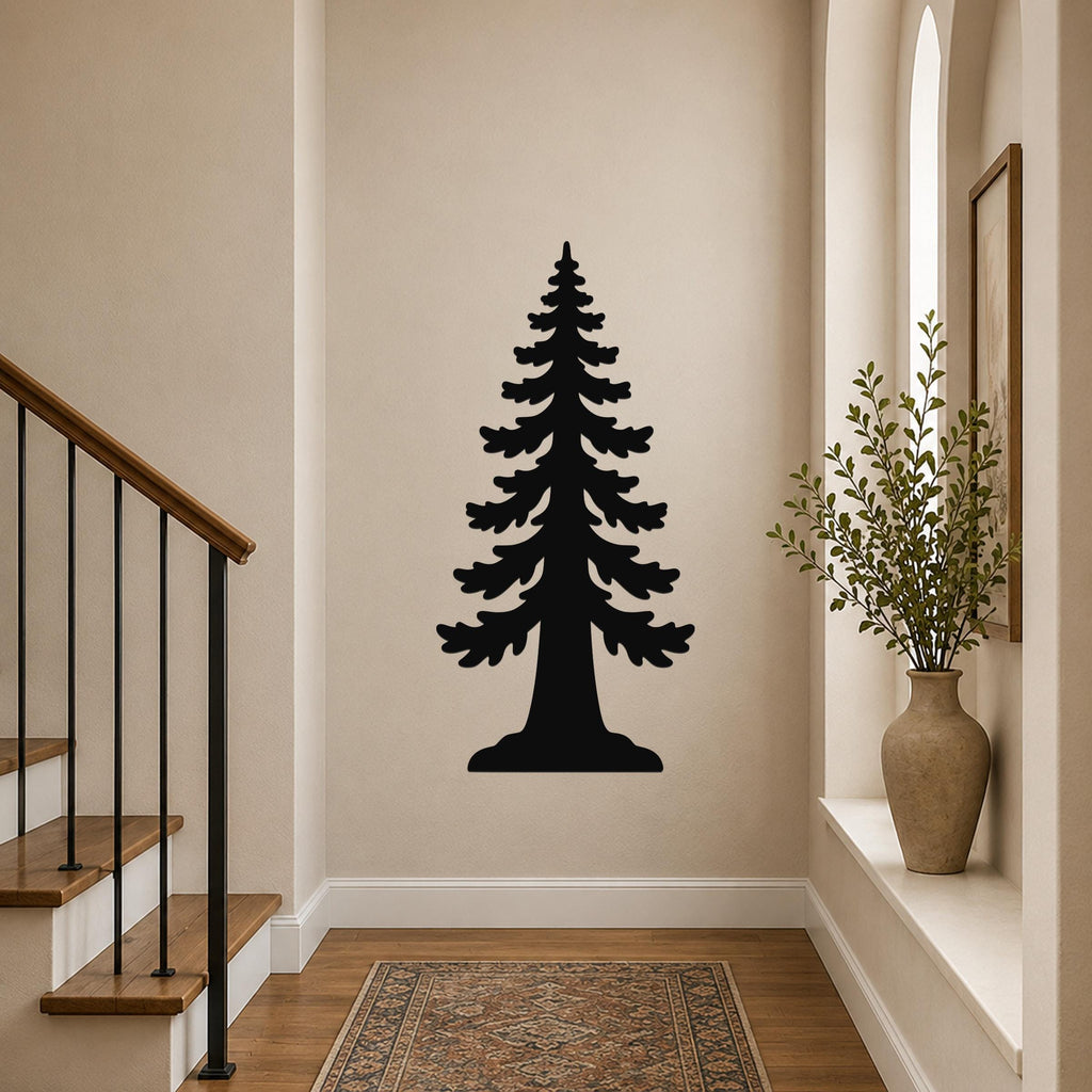 Black metal wall art of a sequoia tree silhouette, mounted on a hallway wall above a patterned rug near a staircase.