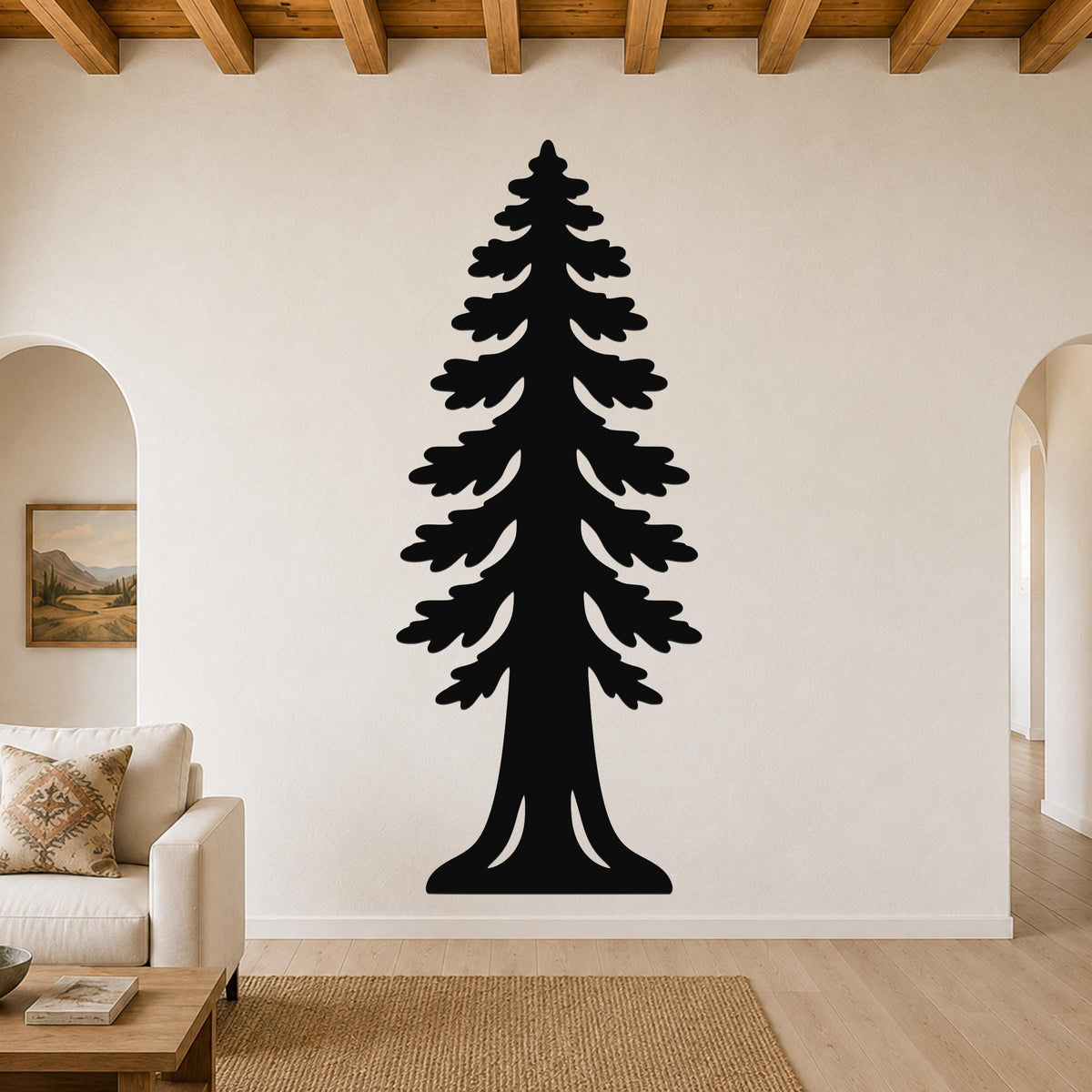 Black metal sequoia tree wall art with layered branch cutouts, mounted on a living room wall above a sofa.