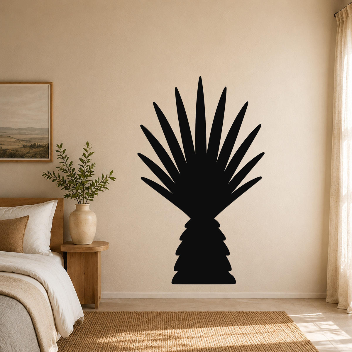 Black metal wall art in the silhouette of a fan palm tree, mounted on a beige bedroom wall above a woven rug.