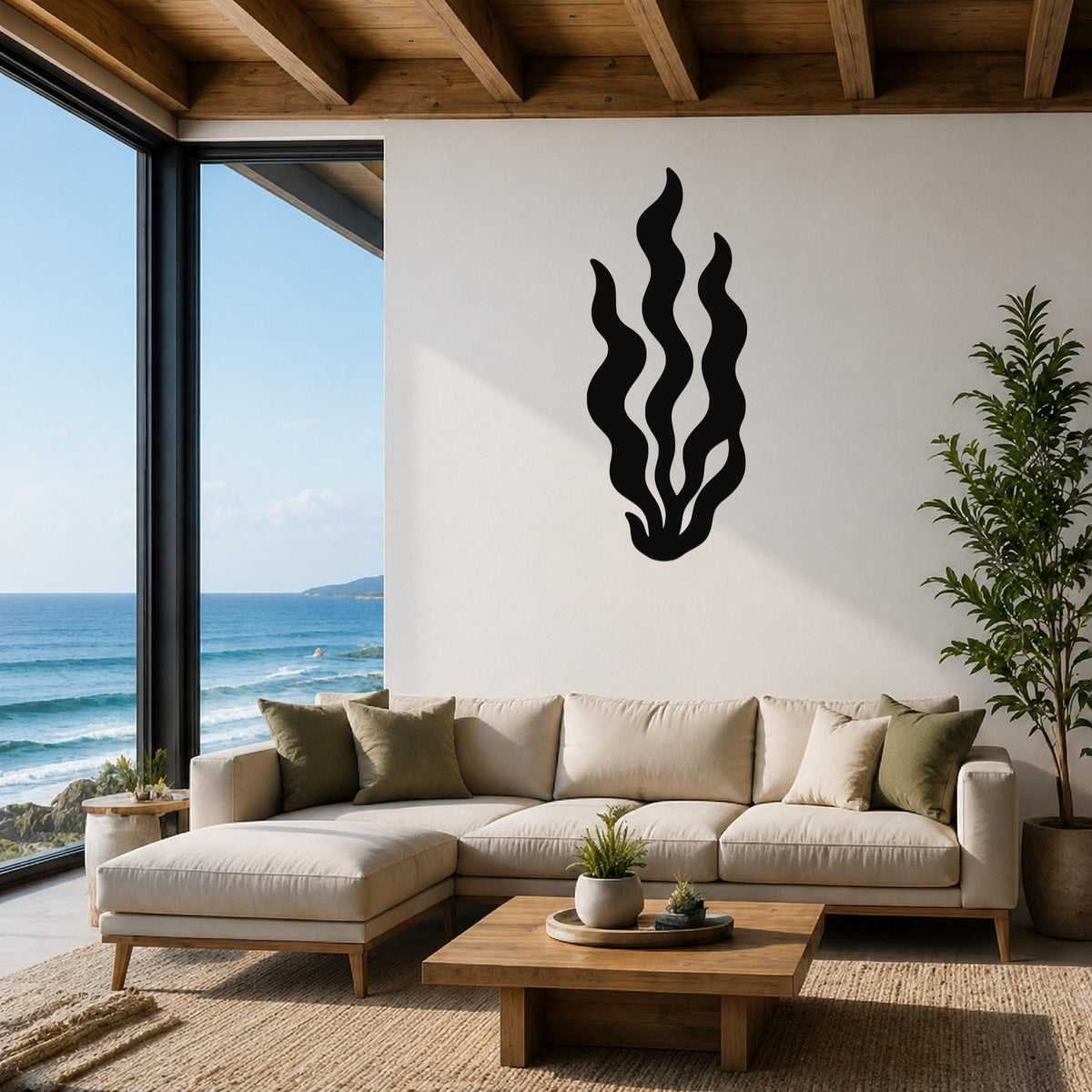 Black metal kelp wall art with flowing wavy cutouts, mounted on a white living room wall above a beige sectional sofa.