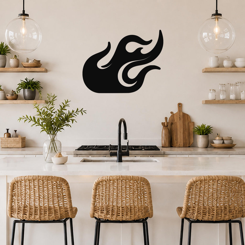 Black metal flame wall art with flowing cutout design, mounted on a kitchen wall above a counter with wicker bar stools.
