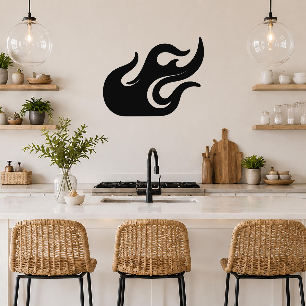 Black metal flame wall art with flowing cutout design, mounted on a kitchen wall above a counter with wicker bar stools.