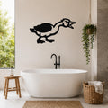 Black metal goose wall art with a minimalist silhouette design, mounted on a bathroom wall above a freestanding tub.