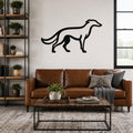 Black metal Borzoi dog wall art silhouette mounted above a brown leather sofa in a living room.