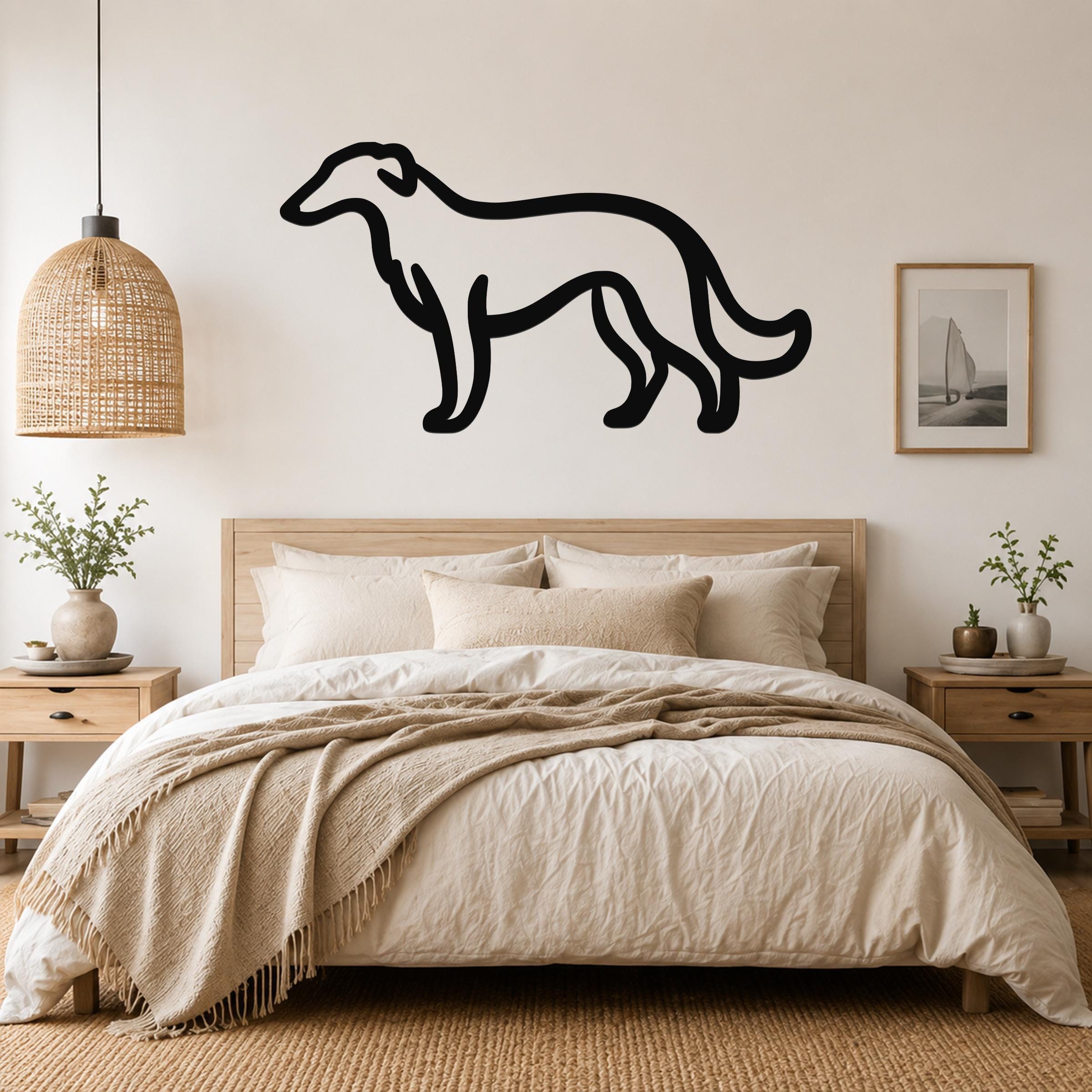 Black metal Borzoi dog wall art silhouette mounted above a wooden bed in a neutral bedroom.