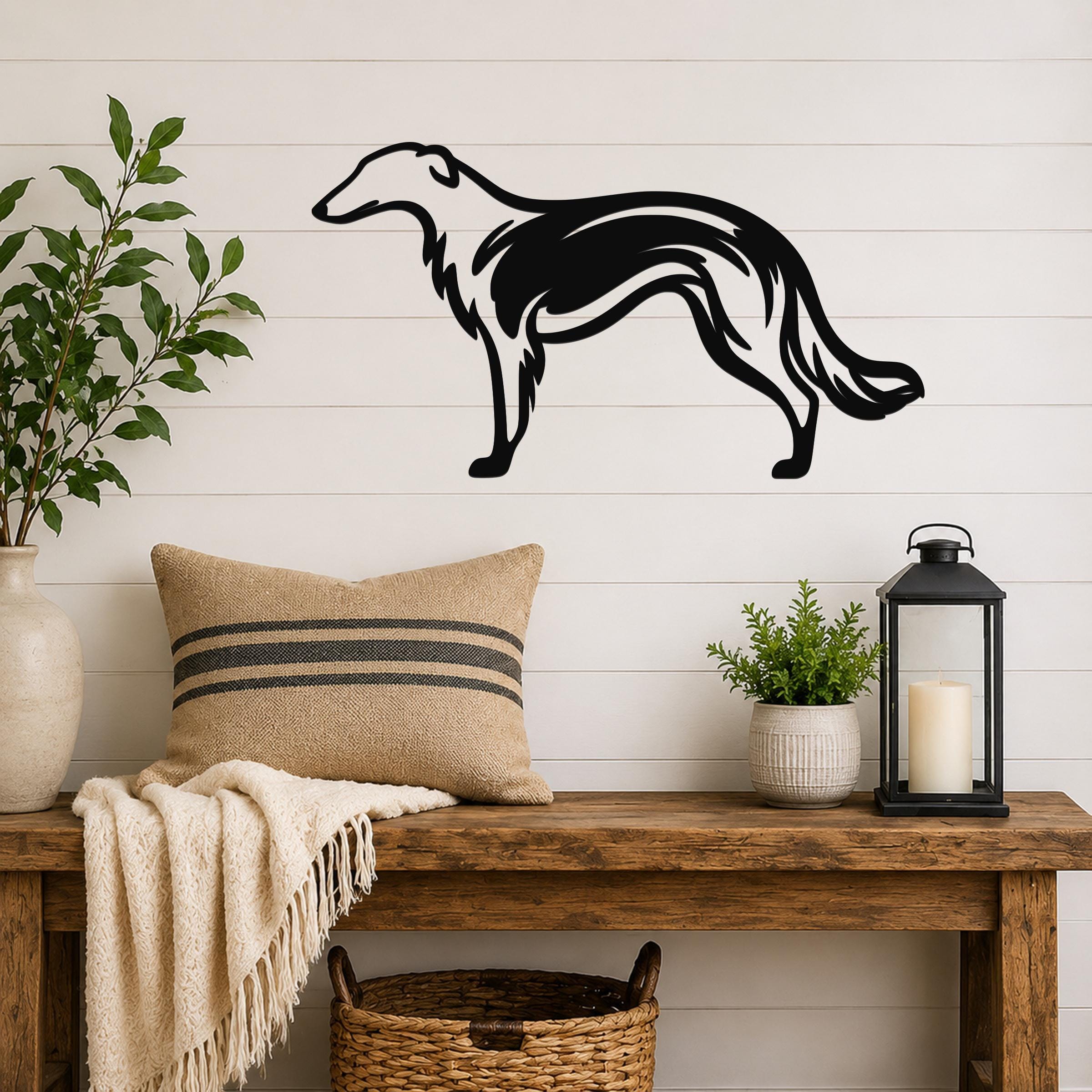 Black metal Borzoi dog wall art with a graceful silhouette and internal motion lines, mounted on a white shiplap wall above a wooden bench in a living room.