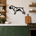 Black metal Boxer dog wall art silhouette with internal cutouts, mounted on a white tiled kitchen wall above a counter.