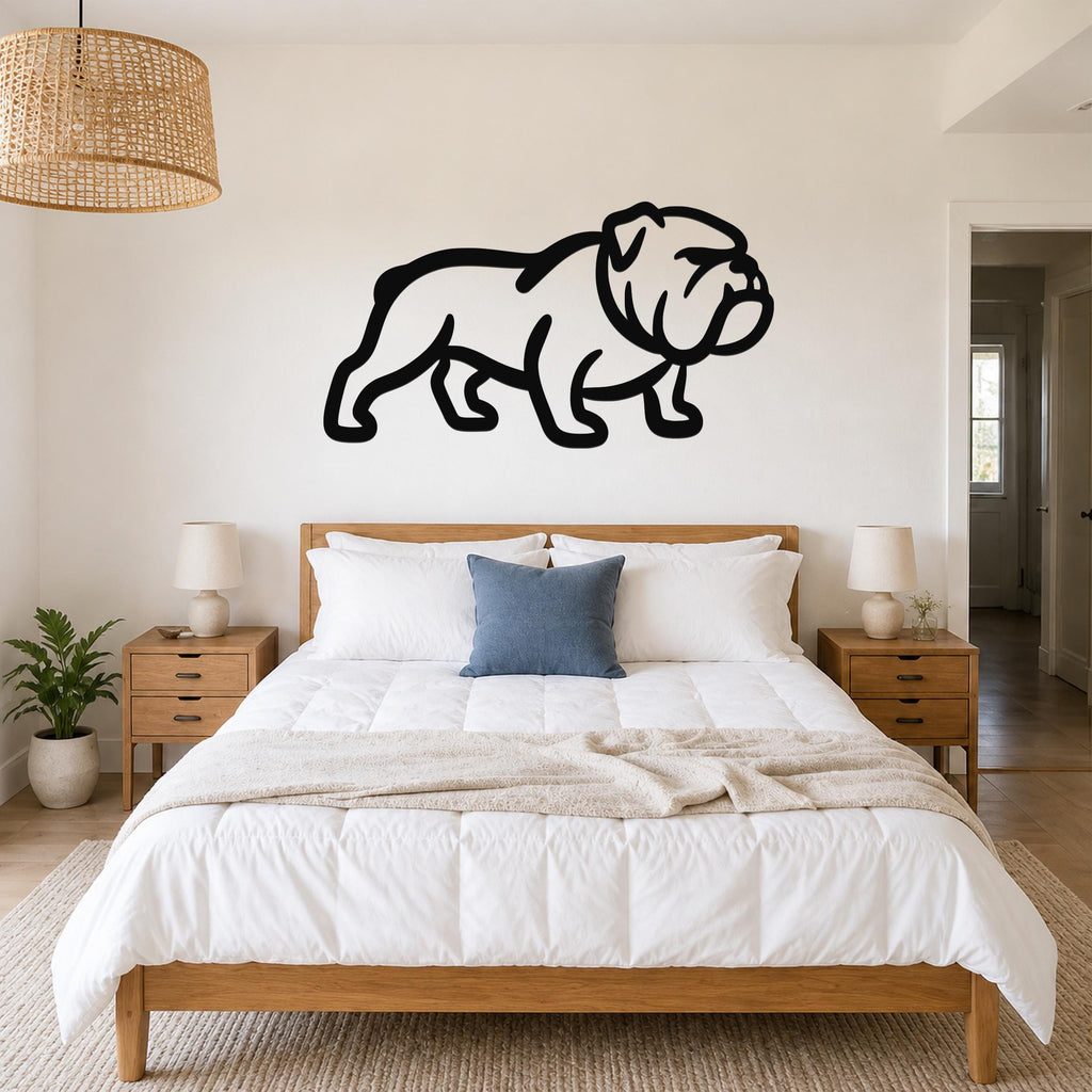 Black metal bulldog wall art silhouette mounted above a wooden bed in a bedroom.