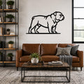 Black metal bulldog wall art in a bold silhouette style, mounted above a brown leather sofa in a living room.