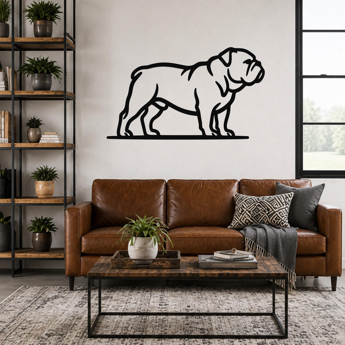 Black metal bulldog wall art in a bold silhouette style, mounted above a brown leather sofa in a living room.