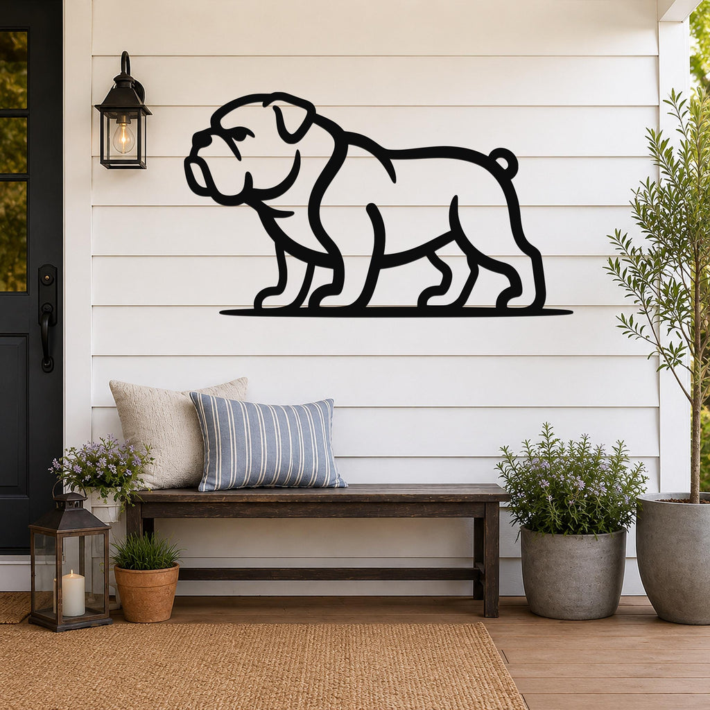 Black metal bulldog wall art silhouette mounted on a white shiplap wall above a wooden bench on a porch.