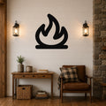 Black metal campfire silhouette wall art mounted on a shiplap wall above a wooden console table in a rustic living room.