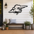 Black metal cloud wall art with a wavy, flowing silhouette, mounted on a white shiplap wall above a wooden bench on a porch.