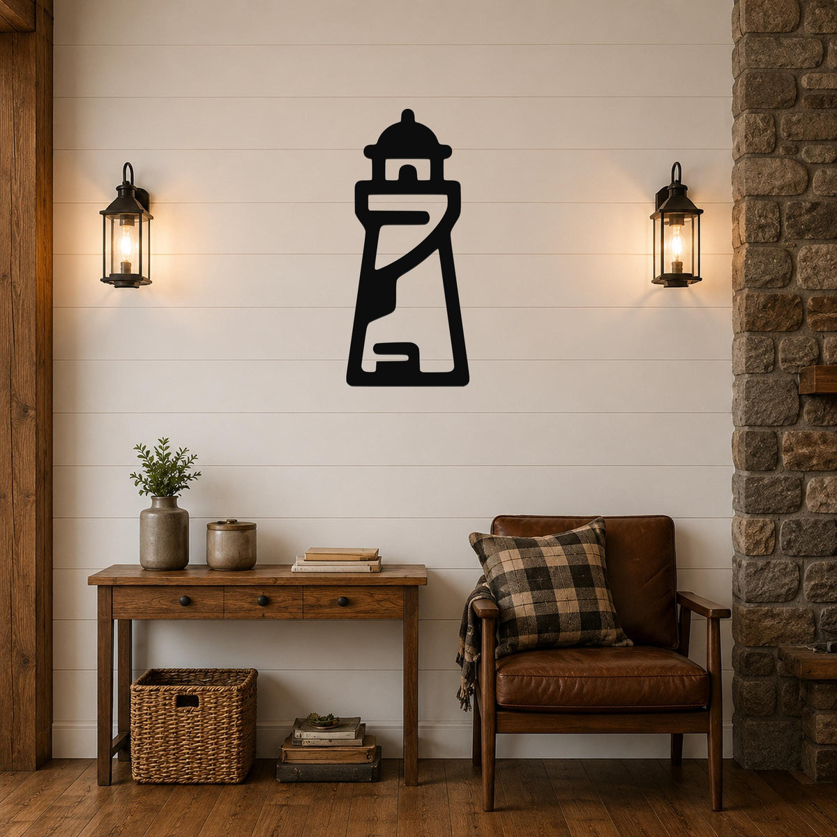 Black metal lighthouse wall art with internal cutout details, mounted on a shiplap wall above a wooden console table in a living room.