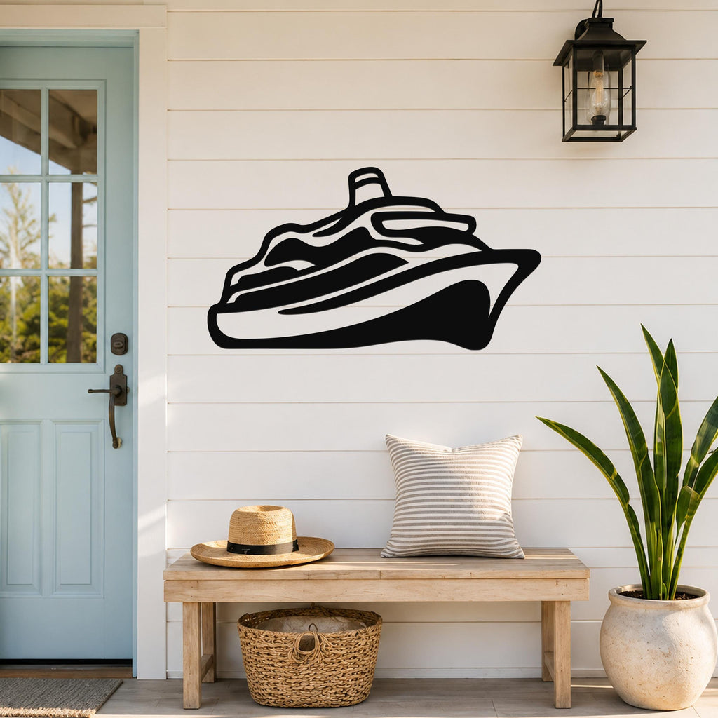 Black metal cruise ship wall art silhouette mounted on a white shiplap wall above a wooden bench in a coastal entryway.