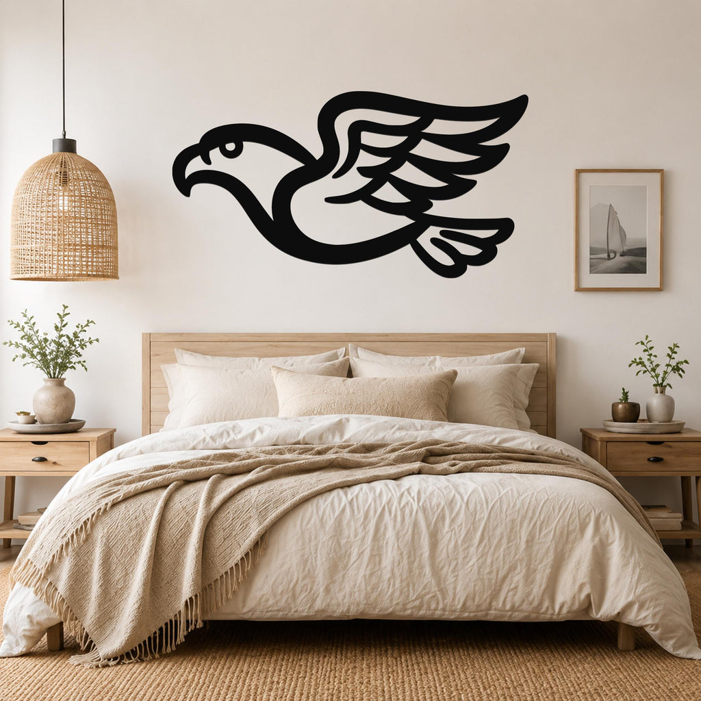 Black metal eagle wall art with a bold silhouette and detailed wing feathers, mounted above a wooden bed in a neutral bedroom.