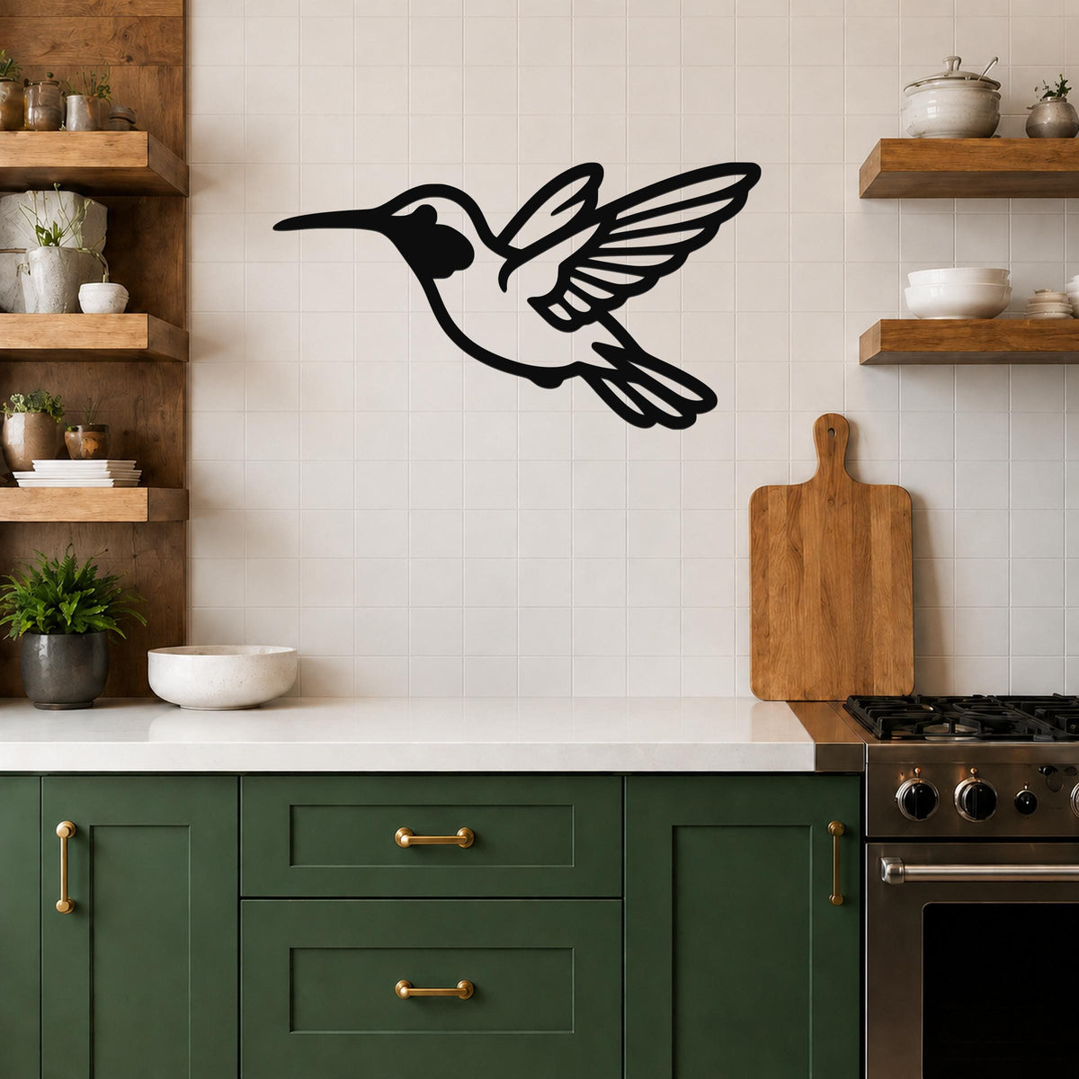 Black metal hummingbird wall art with motion-line cutouts, mounted on a tiled kitchen wall above a counter.
