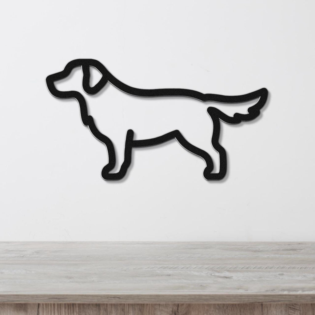 Black metal dog silhouette wall art in a golden retriever shape, mounted on a white wall above a light wood surface.