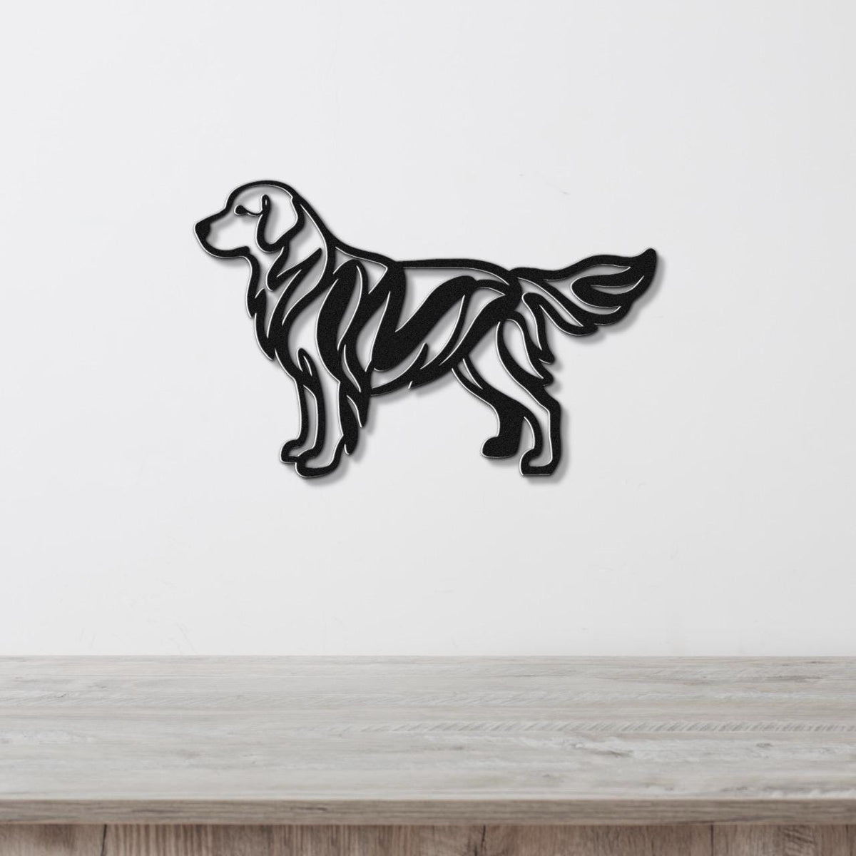 Black metal wall art of a golden retriever in a modern cutout style with internal line details, mounted on a white wall above a light wood surface.