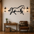 Black metal horse wall art with motion-line cutouts, mounted above a wooden console table in a rustic living room.