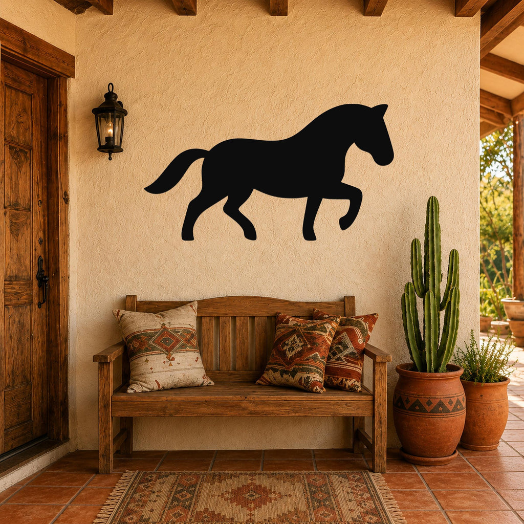 Black metal horse silhouette wall art mounted on a stucco wall above a wooden bench in a rustic patio entryway.