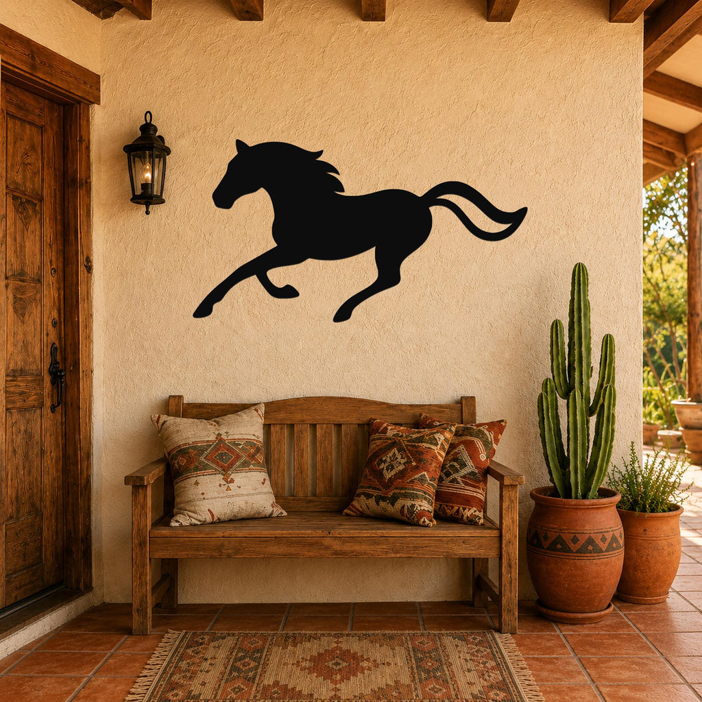 Black metal horse wall art silhouette with motion lines, mounted on a stucco wall above a wooden bench in a rustic patio entryway.