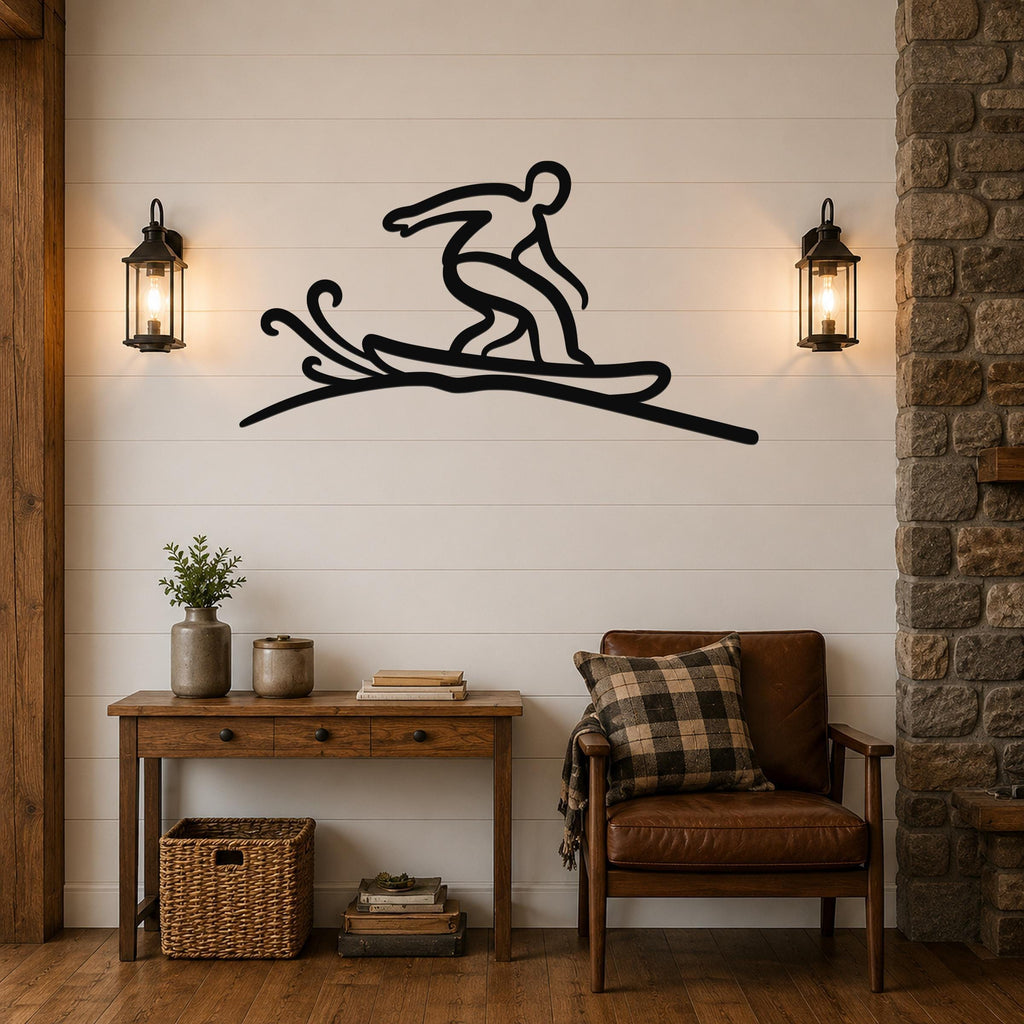 Black metal wall art silhouette of a snowboarder in motion, mounted on a shiplap wall above a wooden console table in a living room.