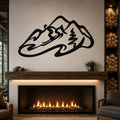Black metal wall art with a minimalist skier silhouette and mountain outline, mounted above a fireplace in a living room.