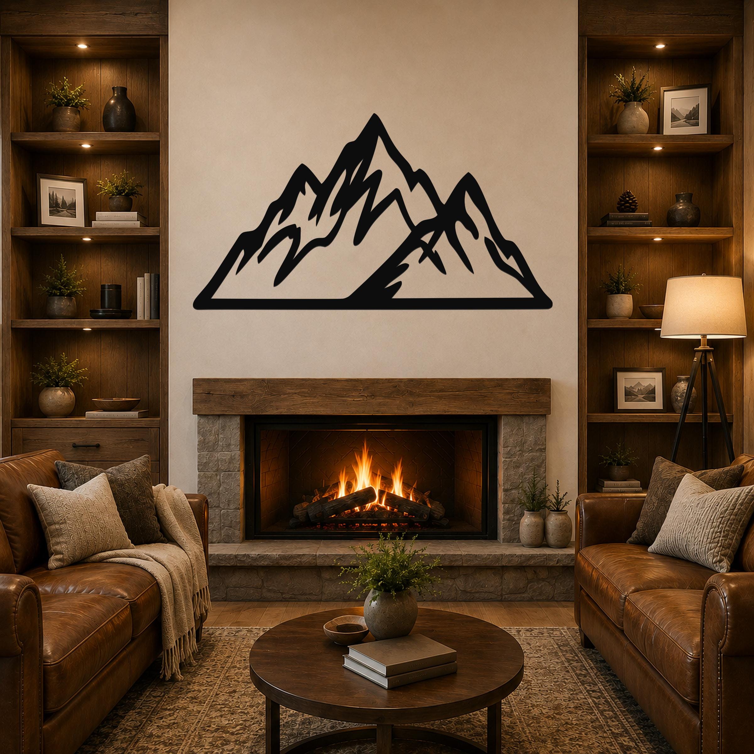 Black metal mountain silhouette wall art with jagged peaks, mounted above a stone fireplace in a rustic living room.