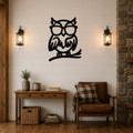Black metal owl wall art with glasses and a branch silhouette, mounted on a shiplap wall above a wooden console table in a rustic living room.