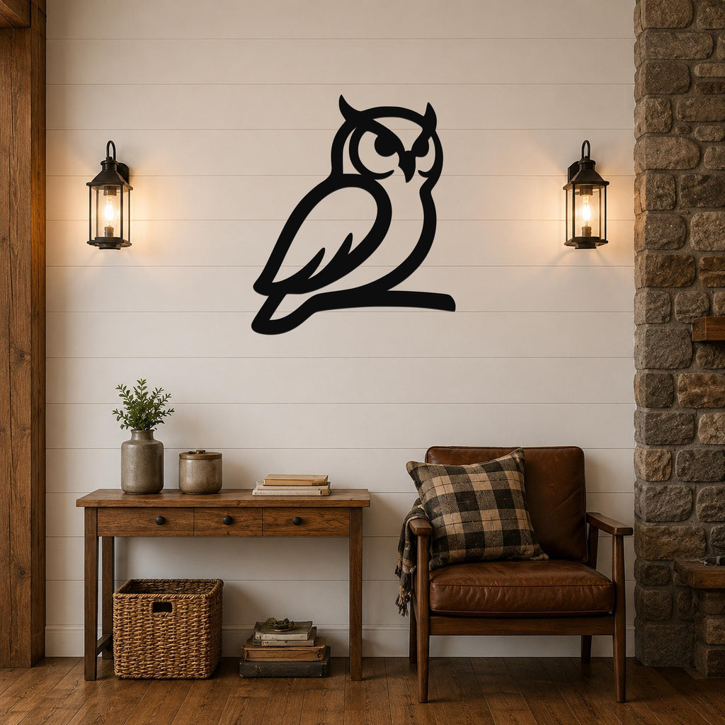 Black metal owl wall art silhouette mounted on a white shiplap wall above a wooden console table in a living room.