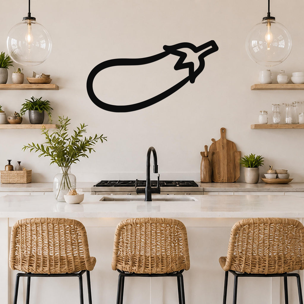 Black metal eggplant wall art silhouette mounted on a kitchen wall above a counter with wicker bar stools.