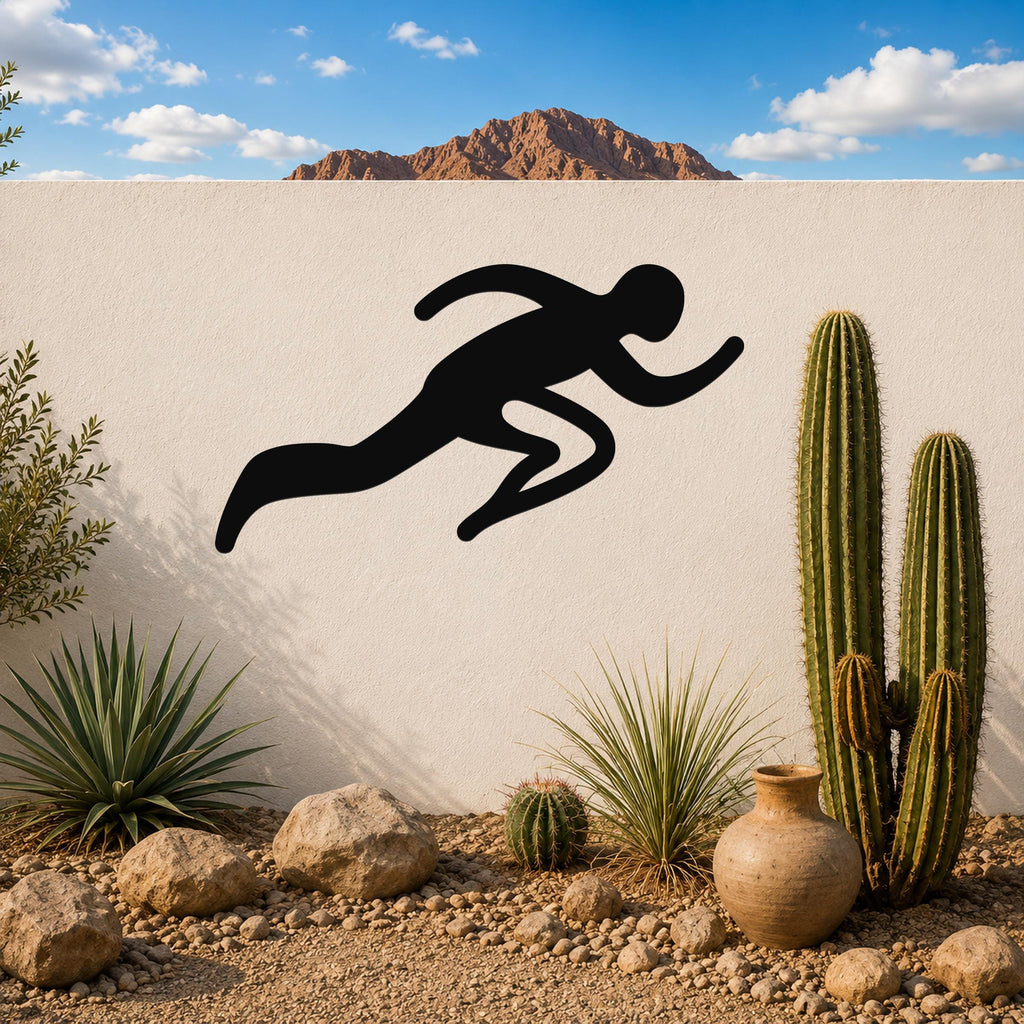 Black metal runner wall art with motion-line cutouts, mounted on a white outdoor wall above a desert garden with cacti and rocks.