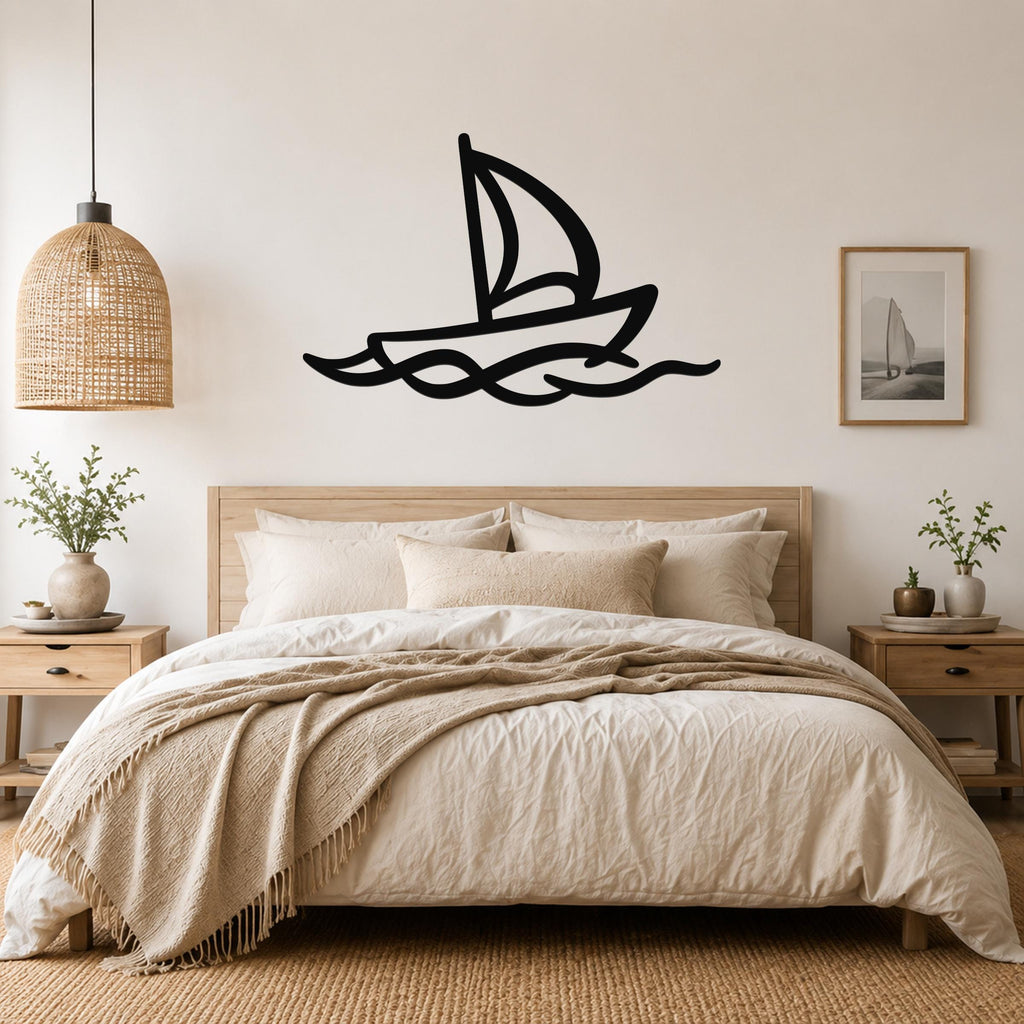 Black metal sailboat wall art with wave cutouts, mounted above a wooden bed in a neutral bedroom.