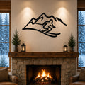 Black metal skier and mountain wall art with a dynamic silhouette, mounted above a stone fireplace in a cozy living room.