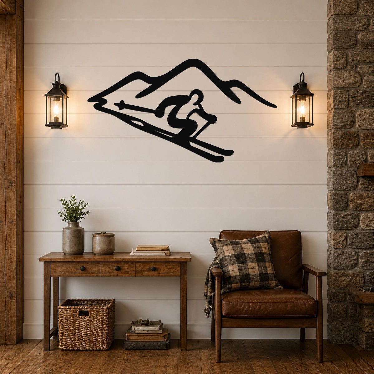 Black metal wall art featuring a skier silhouette in motion against mountain peaks, mounted on a shiplap wall above a wooden console table in a rustic living room.