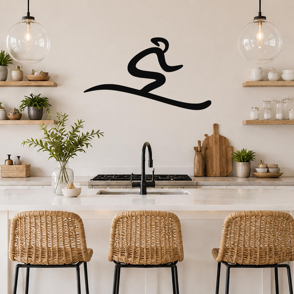 Black metal wall art in a flowing, abstract ski silhouette, mounted on a kitchen wall above a counter with wicker bar stools.
