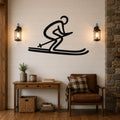 Black metal wall art of a skier silhouette with motion lines, mounted on a shiplap wall above a wooden console table in a living room.