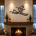 Black metal skier wall art with motion-line cutouts, mounted above a stone fireplace in a cozy living room.