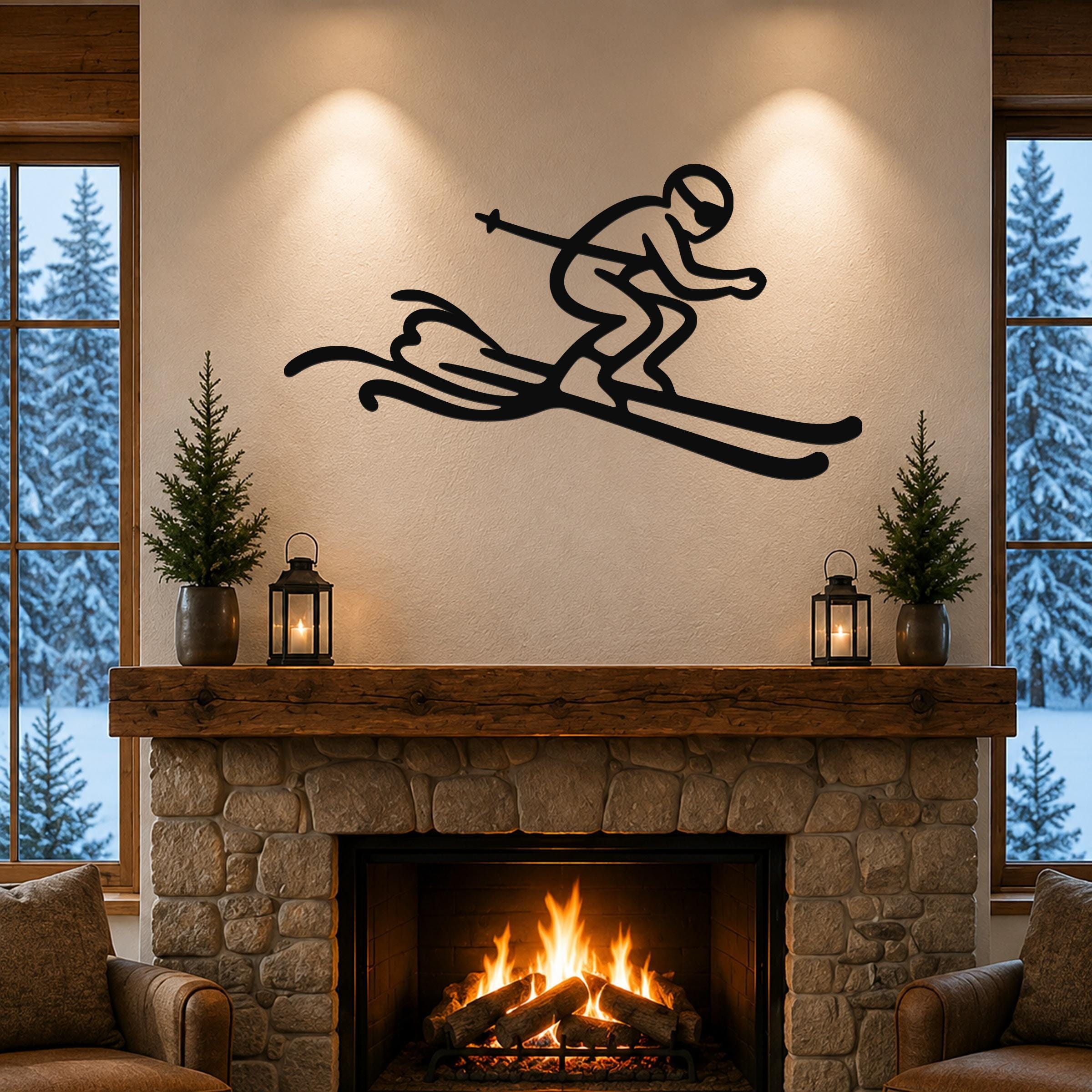 Black metal skier wall art with motion-line cutouts, mounted above a stone fireplace in a cozy living room.