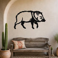 Black metal javelina wall art silhouette mounted on a textured beige wall above a rustic wooden bench in a southwestern-style entryway.